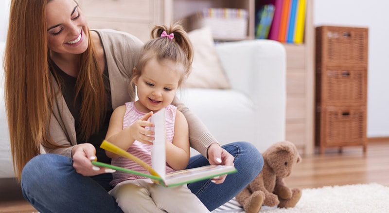 خدمات پرستاری و نگهداری کودک و سالمندان در منزل شما 2 nanny reading to kid 1 800x438 1
